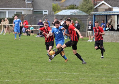 Monkton's Declan Carroll fouled by Goodwick's James Bryan