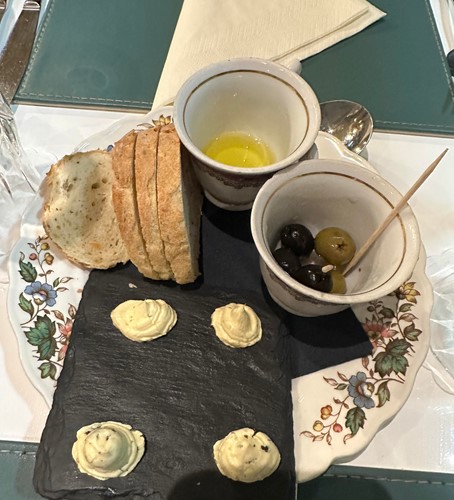 Bread, butters, olives and oil