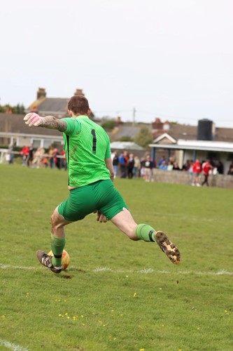 Goodwick United's Kyle Marsh, who saved a penalty to keep his side ahead