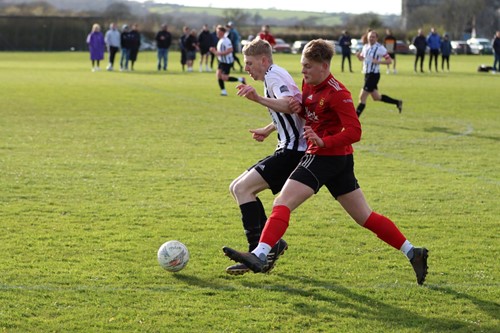 Neyland and Carew battling for the ball