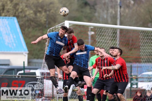 Will Howarth contesting with Mark Jones and Jack Briton from a corner