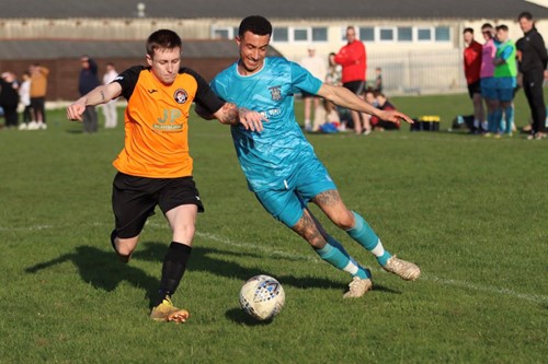 Johnston's Scott Patterson is challenged by Tenby's Daryl Mansbridge