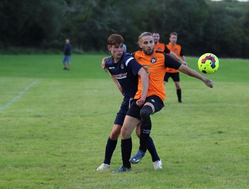 Glenn Hewer challenges for the ball